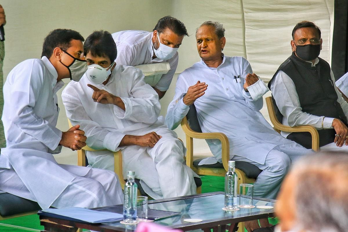 Rajasthan Chief Minister Ashok Gehlot (2nd R) with senior Congress leaders Randeep Surjewala, Avinash Pandey and K.C. Venugopal during a meeting with the party MLAs at his residence in Jaipur, Monday, July 13, 2020. Credit: PTI Photo