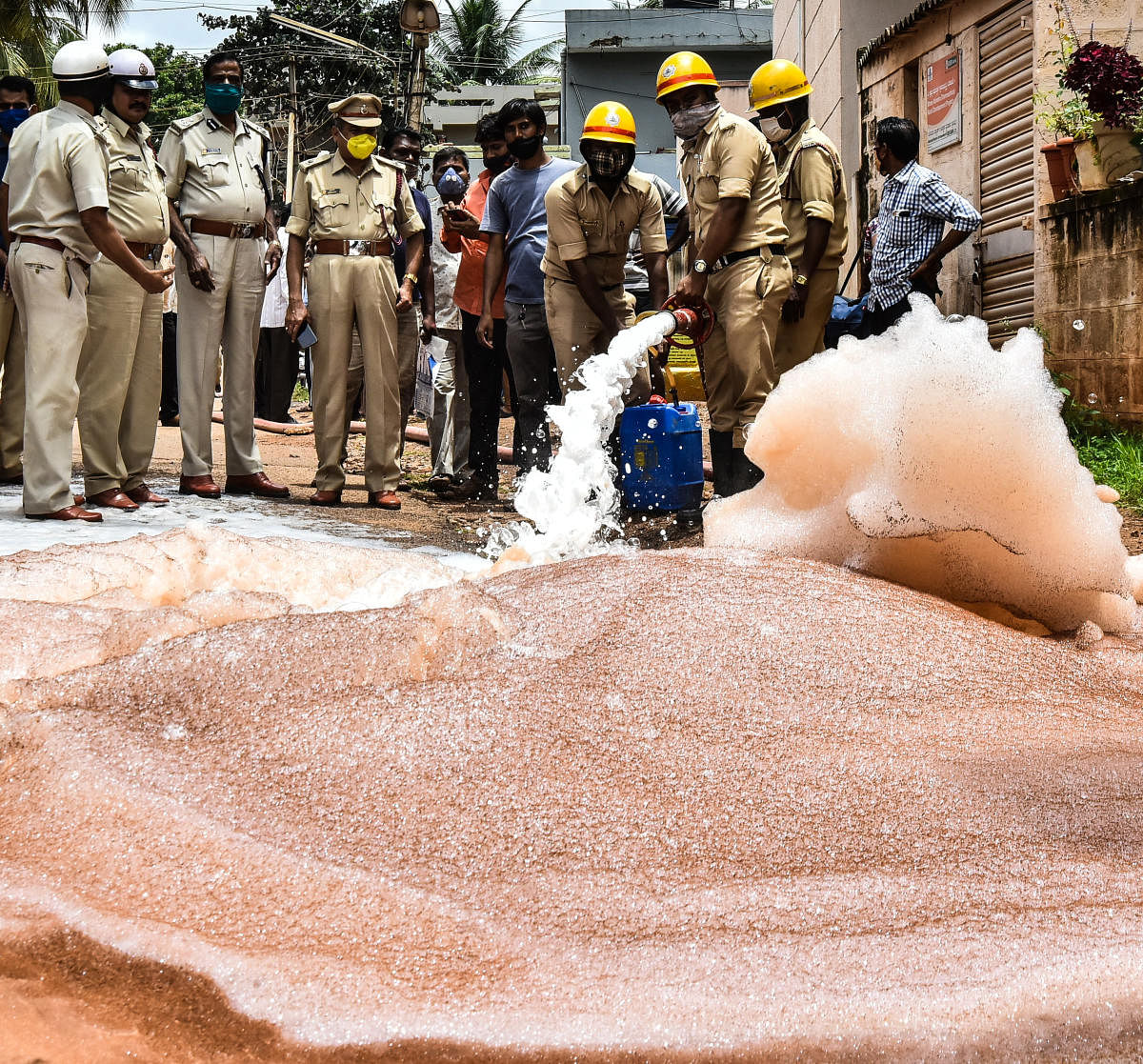 Fire fighters spray fire extinguishing foam at Navanagar in Hubballi on Monday, where gas leaked from the pipeline.