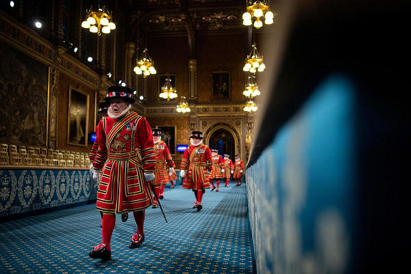 Beefeaters walk through the Royal Gallery. Credit: Reuters Photo