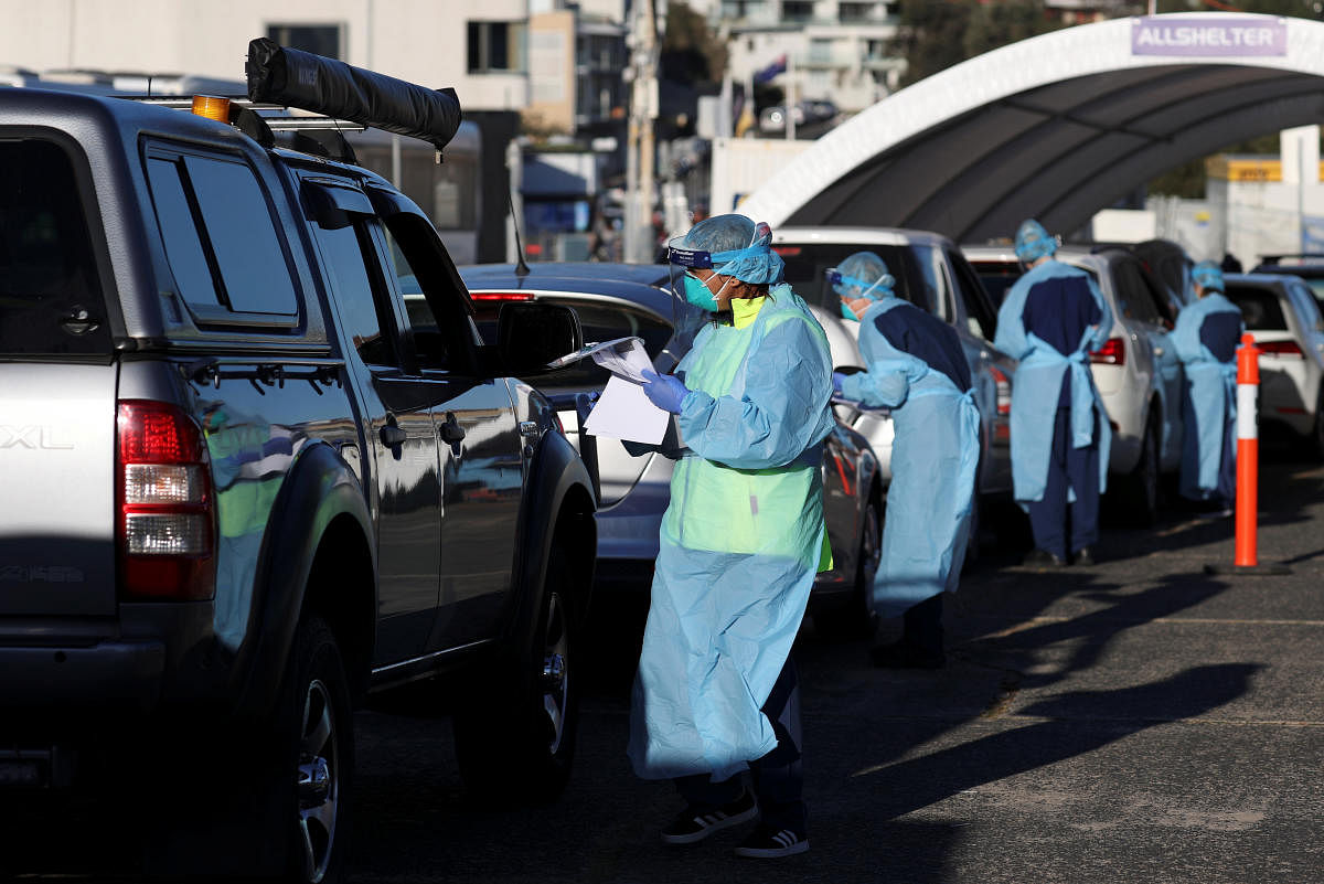 Medical personnel administer tests for the coronavirus disease (COVID-19) at the Bondi Beach drive-through testing centre, as the state of New South Wales grapples with an outbreak of new cases, in Sydney, Australia, July 20, 2020. Credit: Reuters Photo