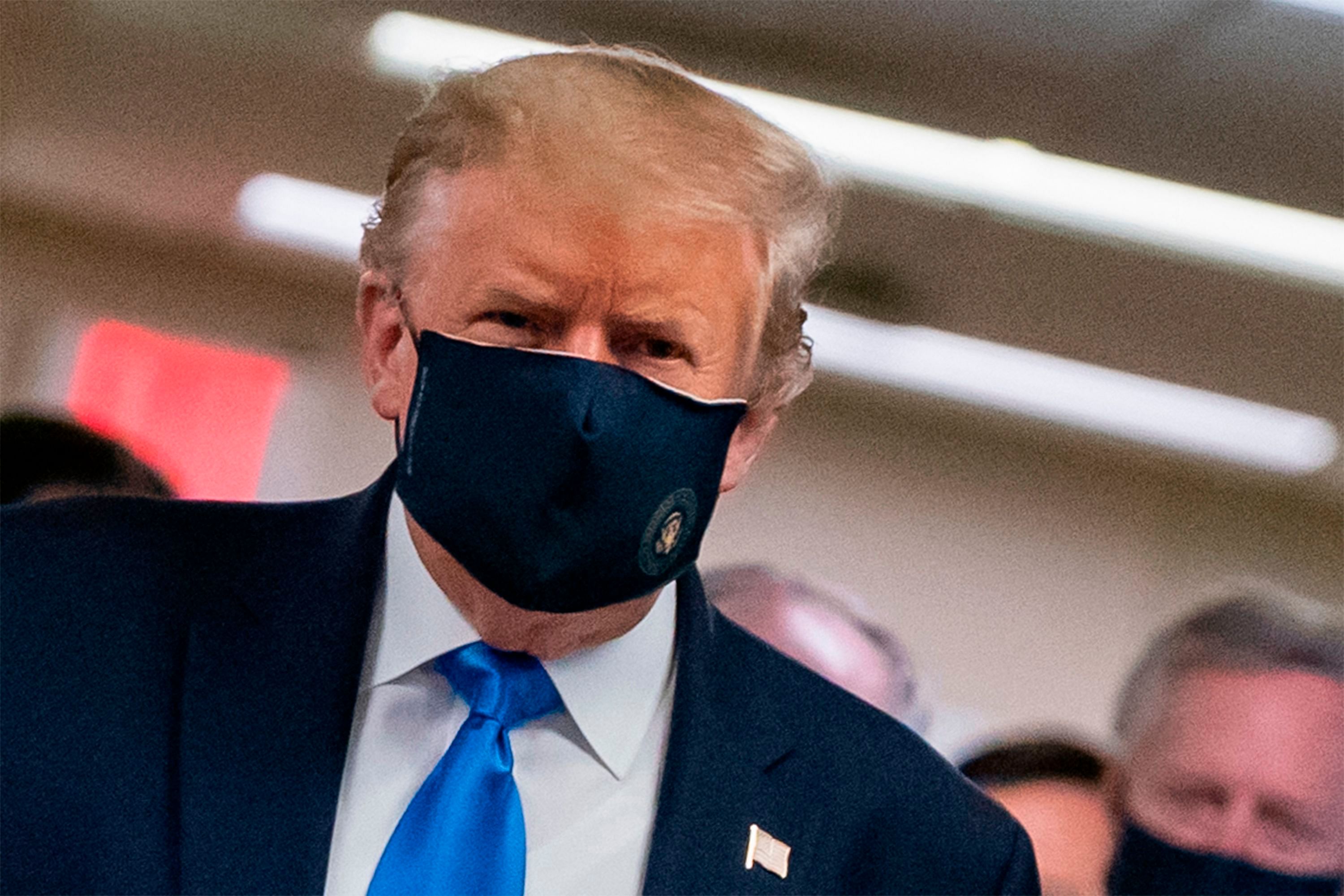 US President Donald Trump wears a mask as he visits Walter Reed National Military Medical Center in Bethesda, Maryland. - US President Donald Trump, who for months refused to encourage mask wearing as a way to combat the coronavirus, on July 20, 2020 tweeted a picture of himself with his face covered and touted his patriotism. Credit: AFP Photo