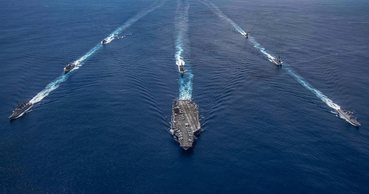 Indian naval ship conducts a Passage Exercise (PASSEX) with the United States Navy’s USS Nimitz carrier strike group near the Andaman and Nicobar (A&N) islands as it transits the Indian Ocean. Credit: PTI