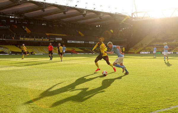 Manchester City's Kevin De Bruyne in action with Watford's Ismaila Sarr, as play resumes behind closed doors following the outbreak of the coronavirus disease. Credit: Reuters