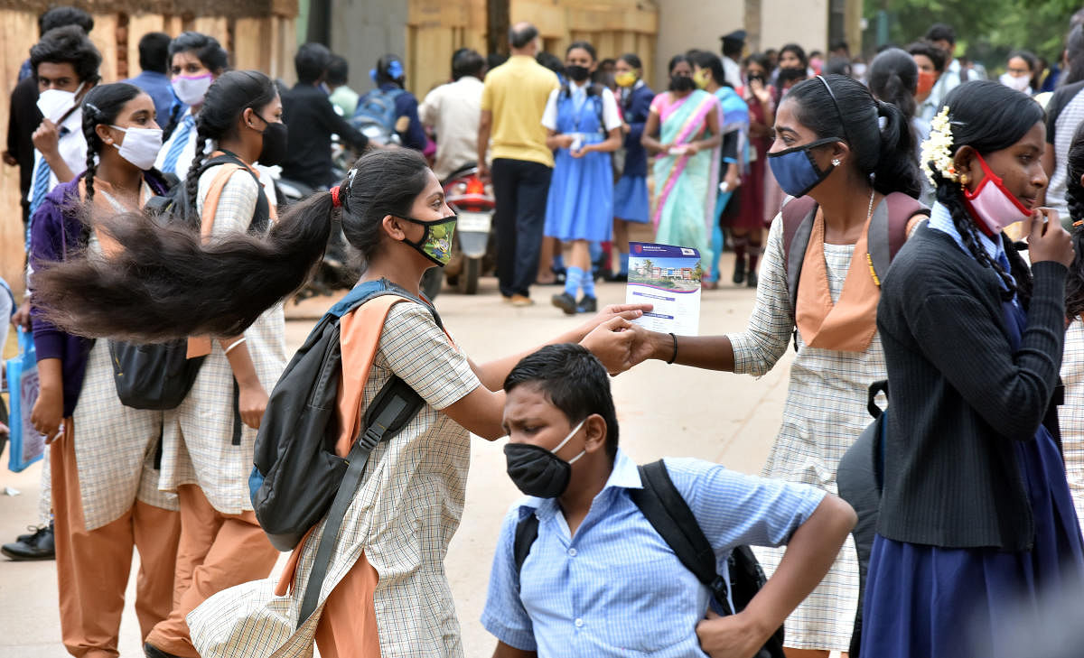 Students celebrating after write SSLC last exam at the M S Ramaiah School at Mathikere in Bengaluru on Friday, 03 July, 2020. Photo by Janardhan B K