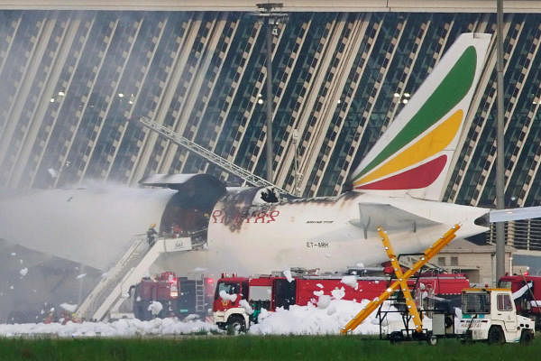 Firefighters work at the site where an Ethiopian Airlines cargo plane caught fire, at Shanghai Pudong International Airport in Shanghai, China. Credit: Reuters Photo