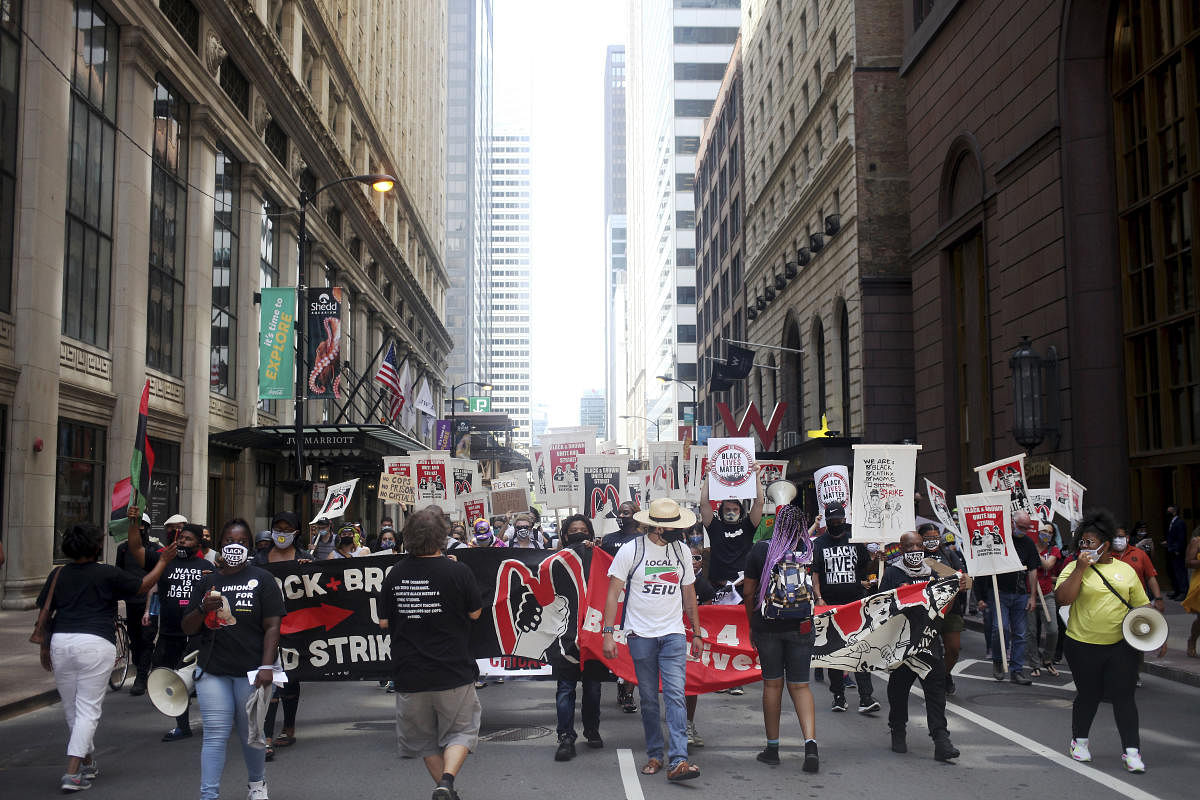 Workers protest racial inequality on national strike. Credit: AP