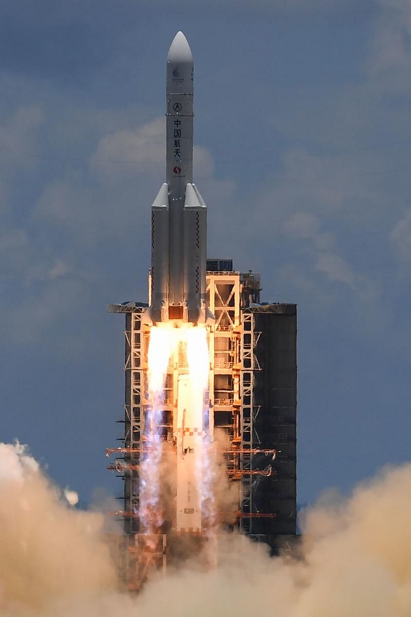 A Long March-5 rocket, carrying an orbiter, lander and rover as part of the Tianwen-1 mission to Mars, lifts off from the Wenchang Space Launch Centre in southern China's Hainan Province. Credit: AFP Photo