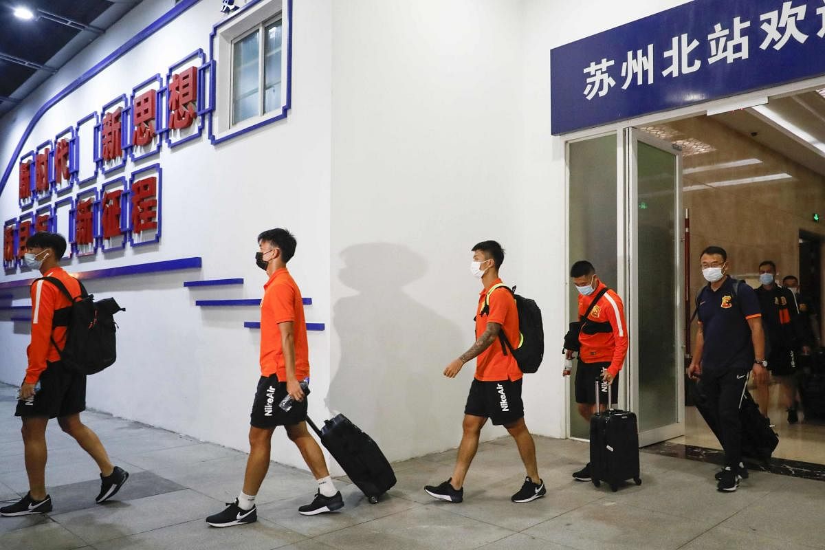 Hundreds of players will spend about 70 days in two sealed-off hotels as China's top-tier football season, which was scheduled to start in February, gets under way more than five months late. Credit: AFP Photo
