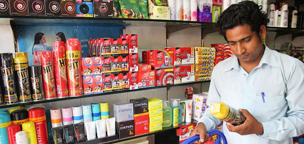 Consumer looks at a Godrej mosquito spray. Credit: DH File Photo