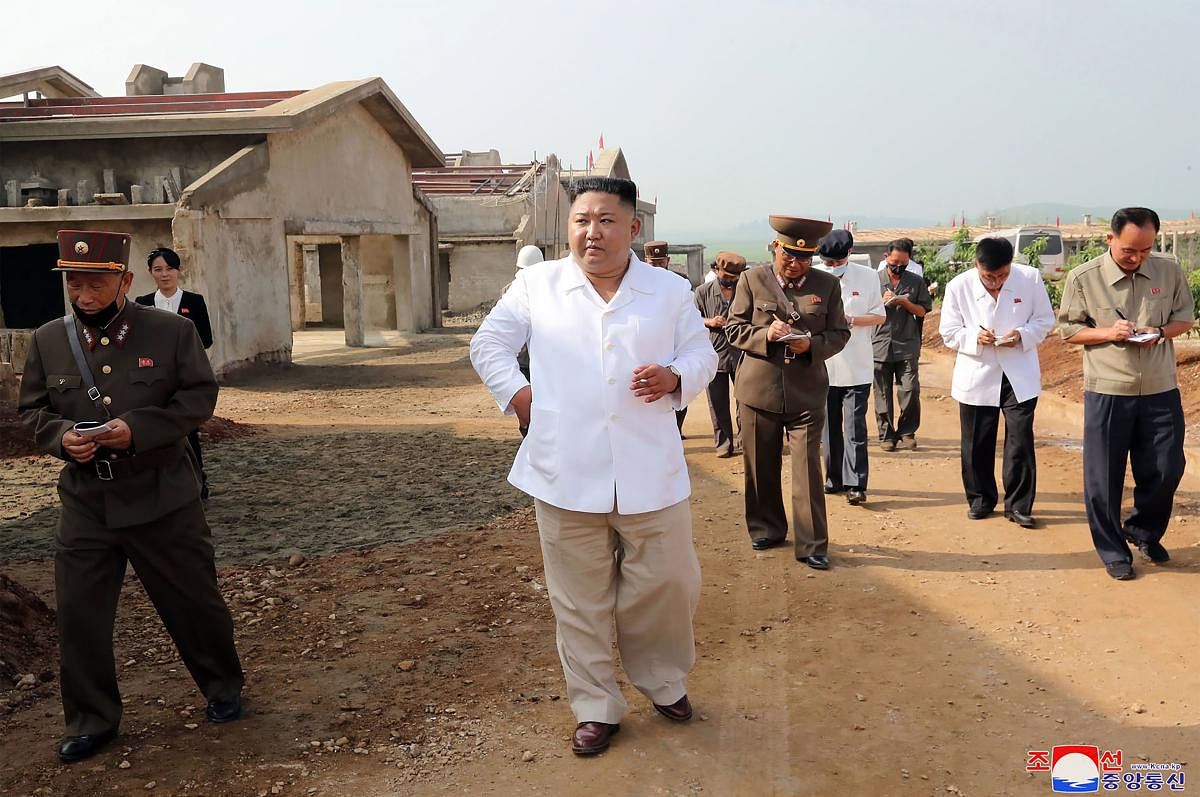  North Korean leader Kim Jong Un visiting the Kwangchon chicken farm under construction in Hwangju County. Credit: AFP Photo