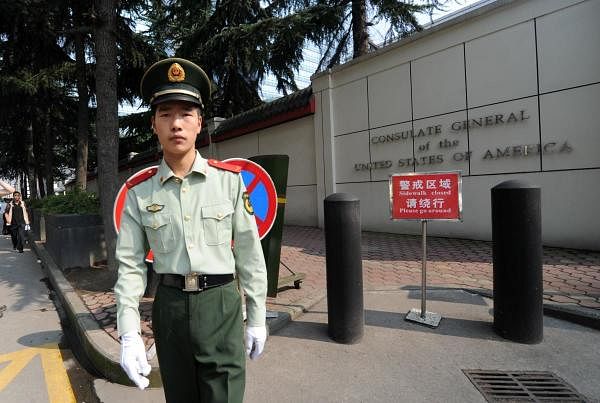 A Chinese paramilitary policeman standing guard at the entrance of the US consulate in Chengdu. Credit: AFP
