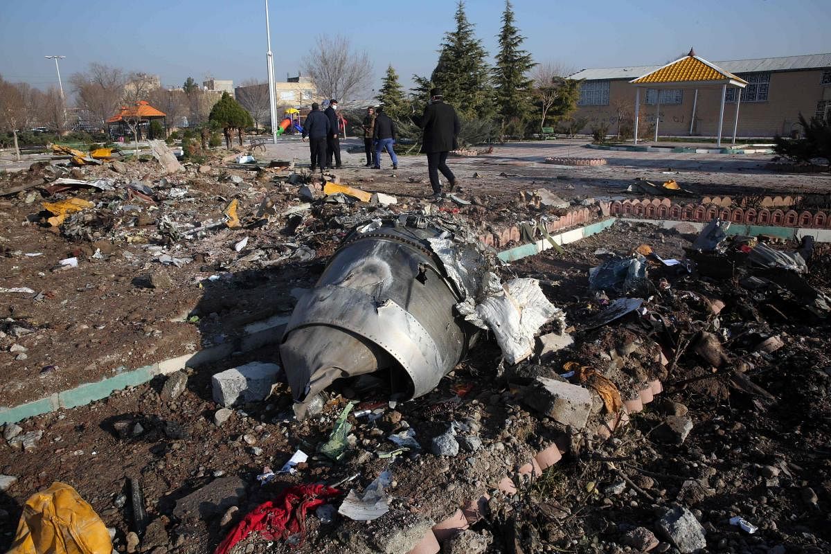  In this file photo taken on January 8, 2020, rescue teams work amidst debris after a Ukrainian plane carrying 176 passengers crashed. Credit: AFP
