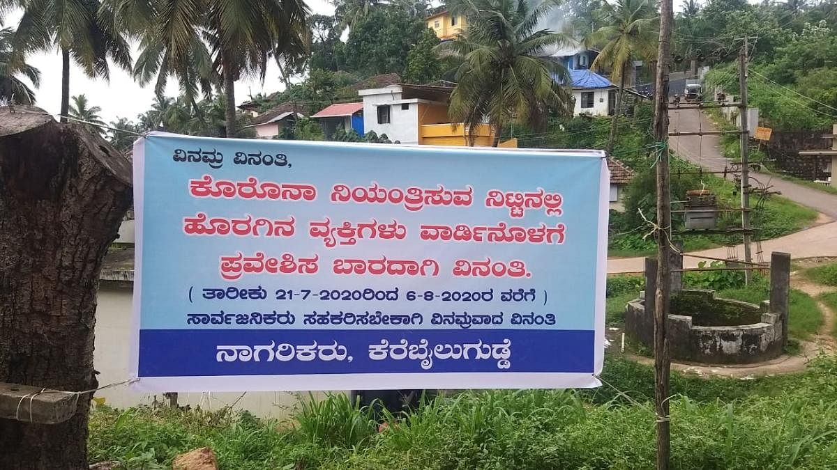 Following a surge in Coronavirus cases, residents of Karebailu Gudda in Mangaluru placed a banner appealing outsiders not to step into their ward, until August 06. Credit: DH