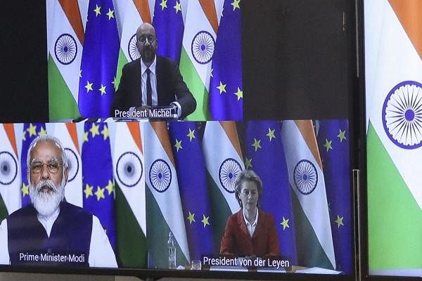 European Council President Charles Michel, top screen, and European Commission President Ursula von der Leyen, screen right, speak with India's Prime Minister Shri Narenda Modi, screen left, during an EU-India videoconference summit. Credit: AP