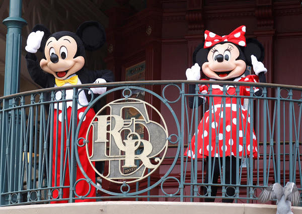 Disney characters Mickey Mouse and Minnie welcome visitors at Disneyland. Credit: AFP