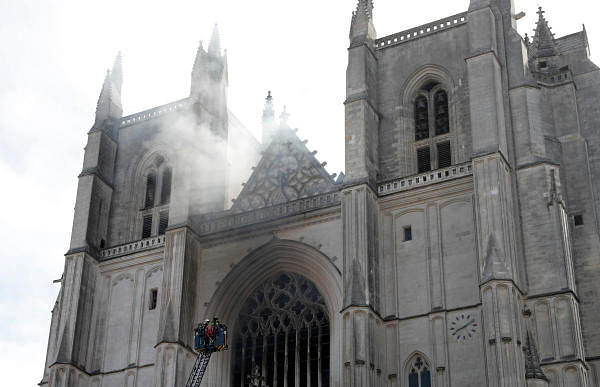 French firefighters battle a blaze at the Cathedral of Saint Pierre and Saint Paul in Nantes, France. Credit: Reuters