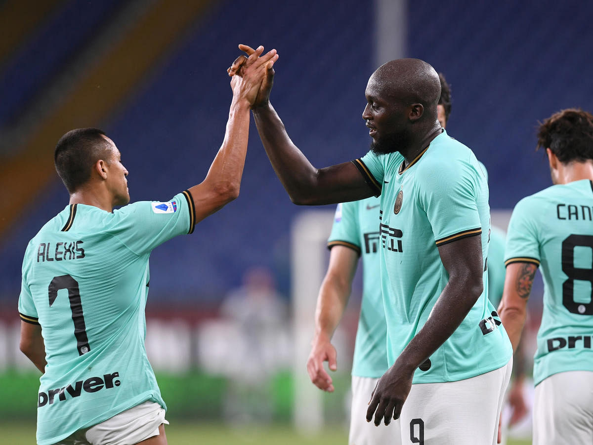 Inter Milan's Romelu Lukaku celebrates scoring their third goal with Alexis Sanchez. Credit: Reuters Photo