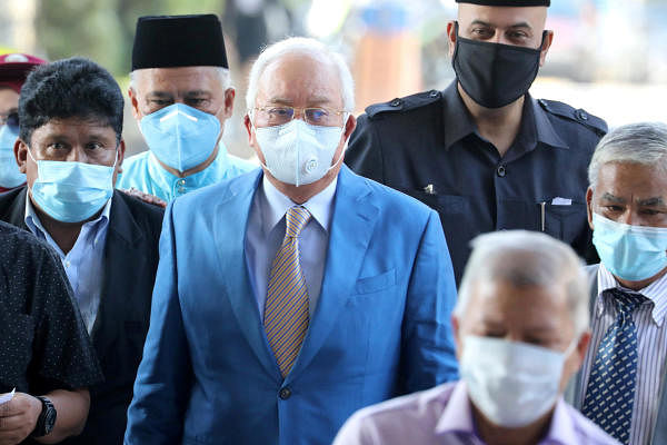Former Malaysian Prime Minister Najib Razak and his supporters arrive at Kuala Lumpur High Court in Kuala Lumpur, Malaysia. Credit: Reuters Photo