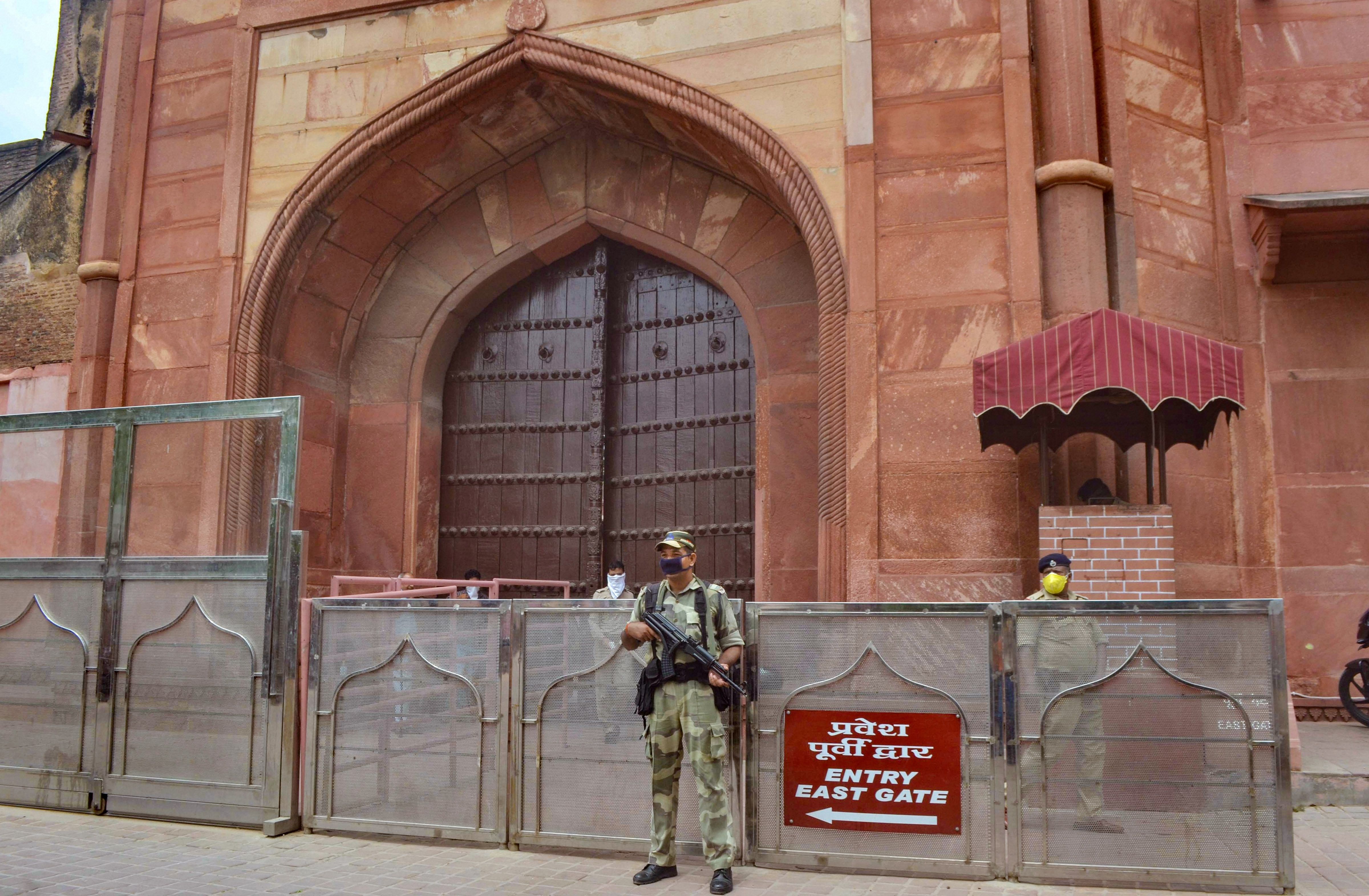 A security person guards at the historic Taj Mahal in Agra, Monday, July 6, 2020. The Agra district administration has decided not to reopen the Taj Mahal for visitors amid concern over rising COVID-19 cases in the city, despite the government's decision to reopen monuments from July 6. Credit: PTI Photo