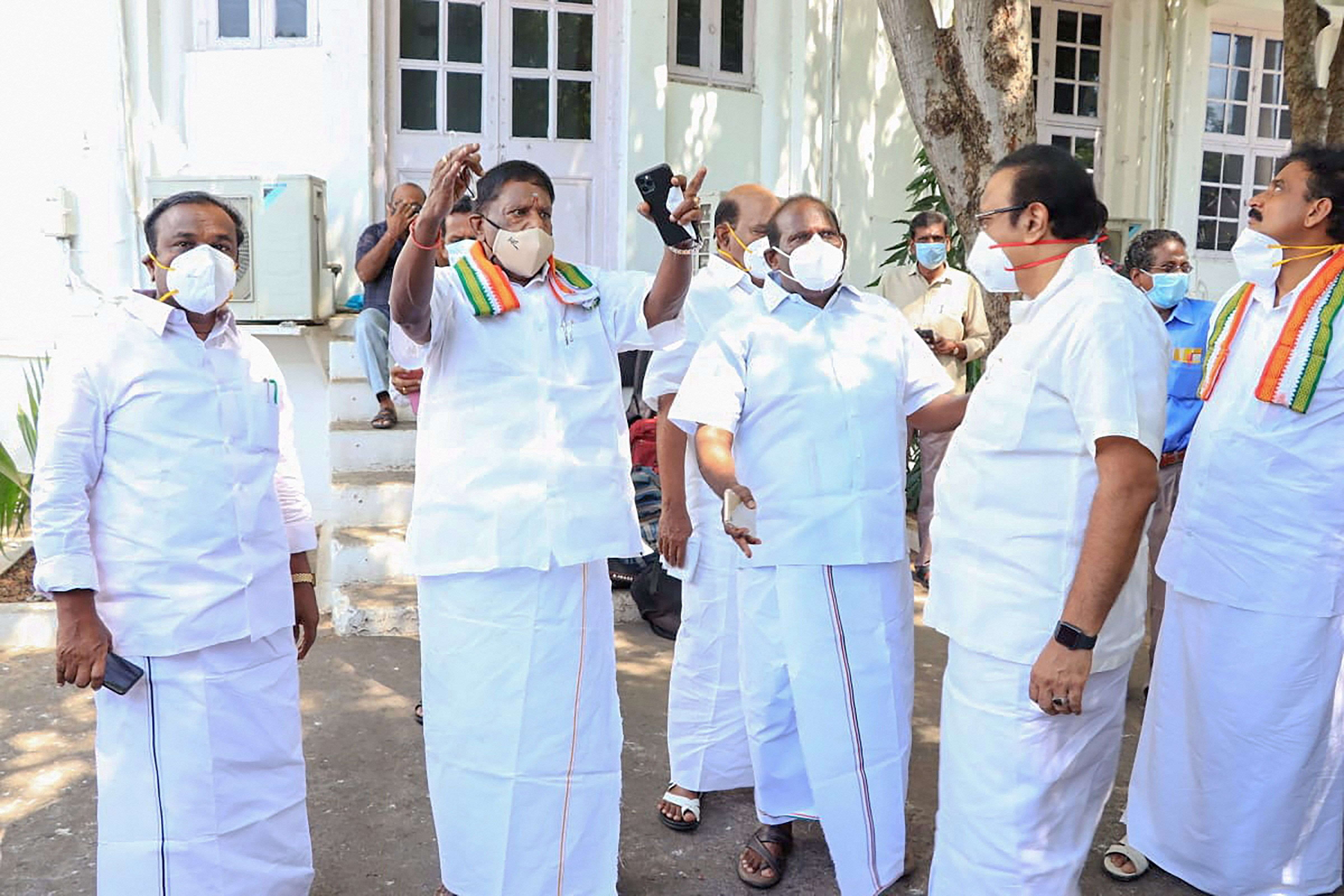 Puducherry Chief Minister V Narayayanasamy (2nd L) with Speaker Sivakozhundu and other leaders visit the garden area of the Assembly premises to convene its session as the hall was being disinfected in the view of coronavirus pandemic, in Puducherry, Saturday, July 25, 2020. Credit: PTI Photo
