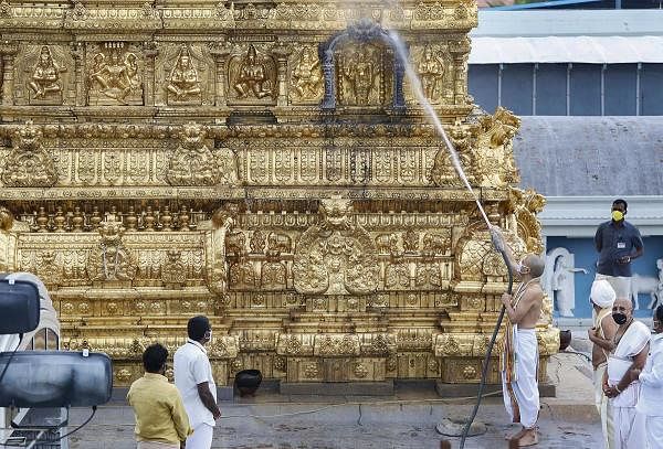 Officials clean the Tirupati Balaji Temple as they perform 'Koil Alwar Thirumanjanam' ritual. Credit: PTI