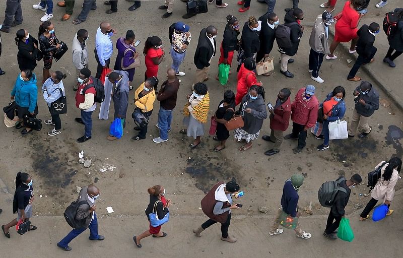 Residents queue for public transport before the curfew to curb the spread of the coronavirus disease. Credits: Reuters Photo