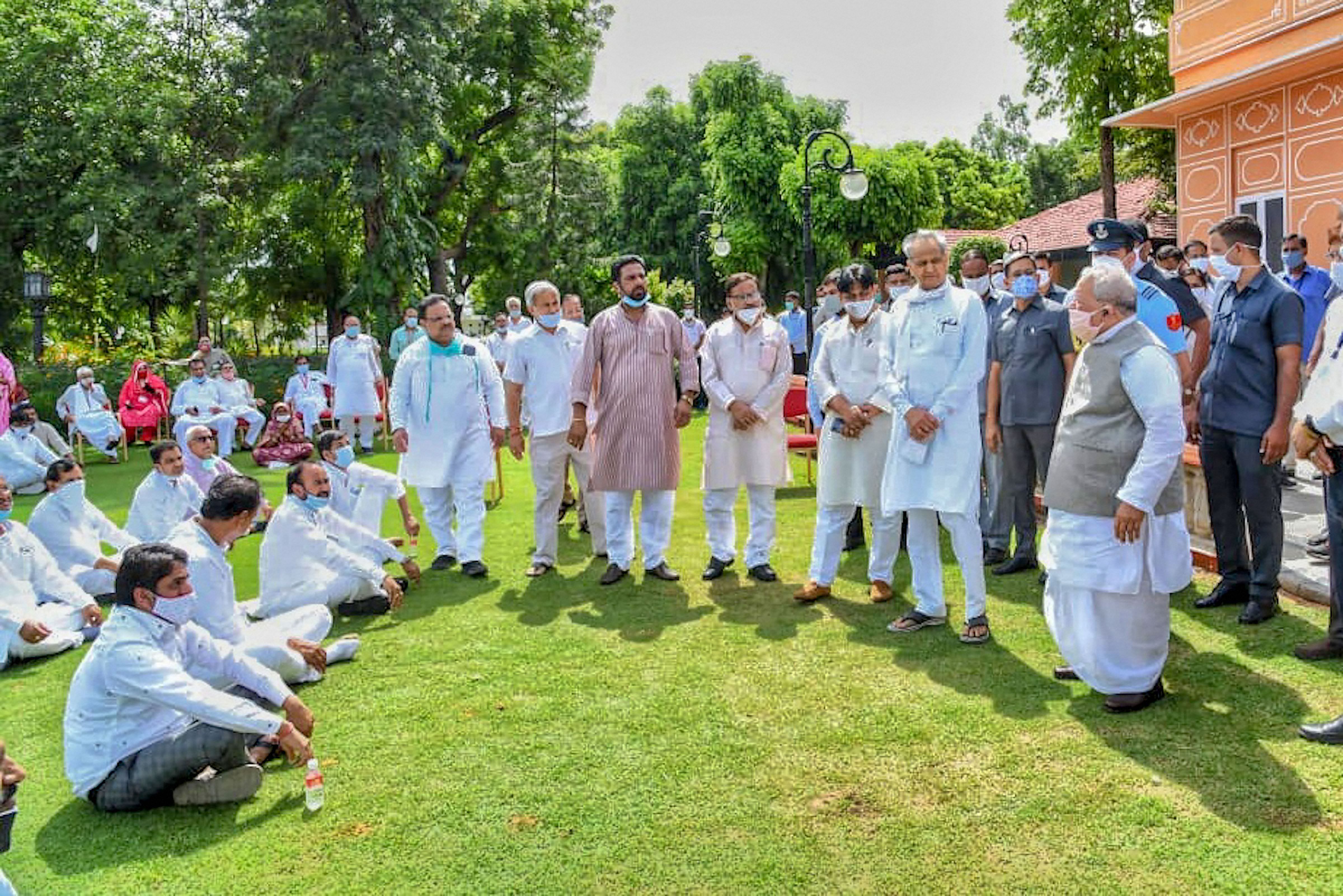 Governor Kalraj Mishra interacts with the Congress MLAs who accompanied Rajasthan Chief Minister Ashok Gehlot to the Raj Bhawan. Credit: PTI Photo