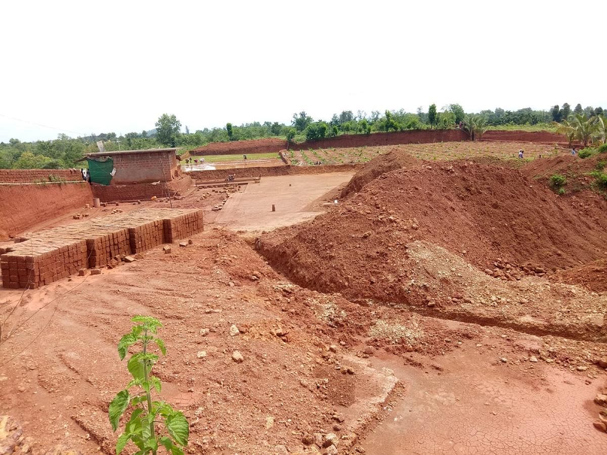 The quarry land being levelled to carrying out farming activities at Ujirbettu.