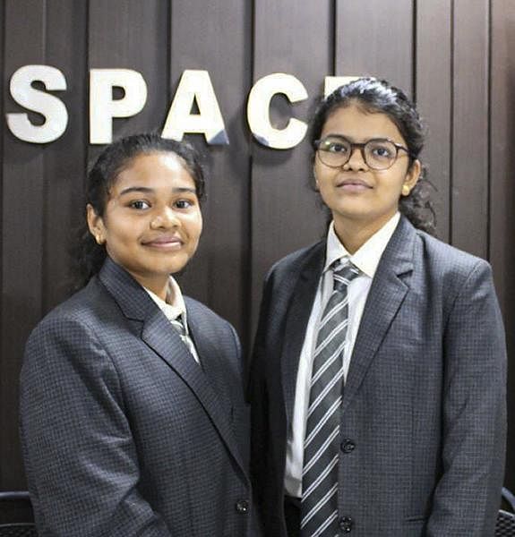 Vaidehi Vekariya Sanjaybhai (R) and Radhika Lakhani Prafulbhahas, class 10 students, who jointly helped discover a near-Earth asteroid, which has been christened as HLV2514 by the National Aeronautics and Space Administration (NASA), in Surat. Credit: PTI Photo
