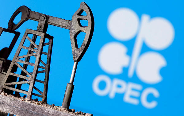 A 3D printed oil pump jack is seen in front of displayed Opec logo. Credit: Reuters Photo