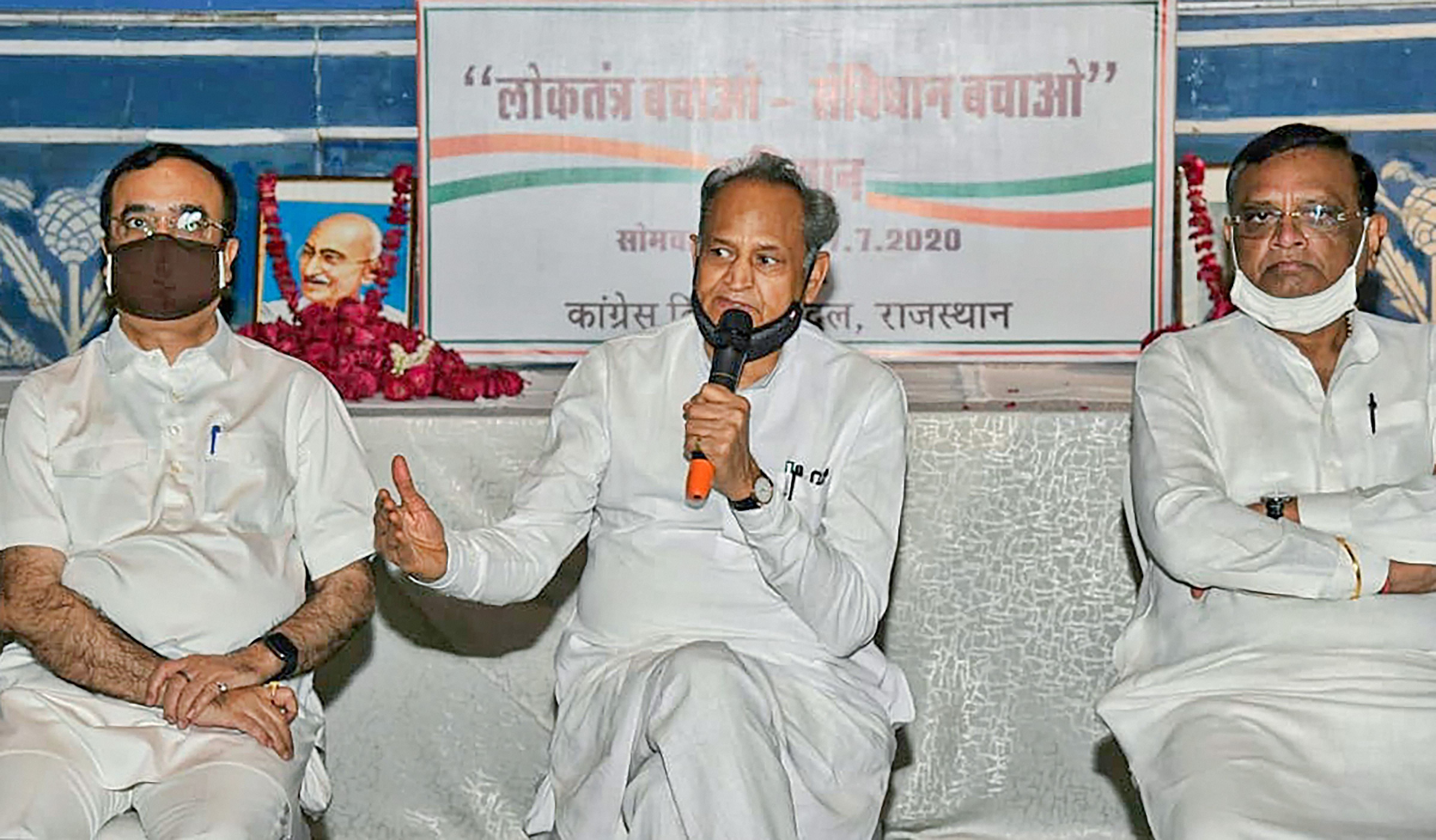 Rajasthan Chief Minister Ashok Gehlot, Congress senior leaders Ajay Maken and Avinash Pandey take part in an MLAs meeting organised under the 'Save Democracy-Save Constitution, at hotel in Jaipur, Monday, July 27, 2020. Credit: PTI Photo