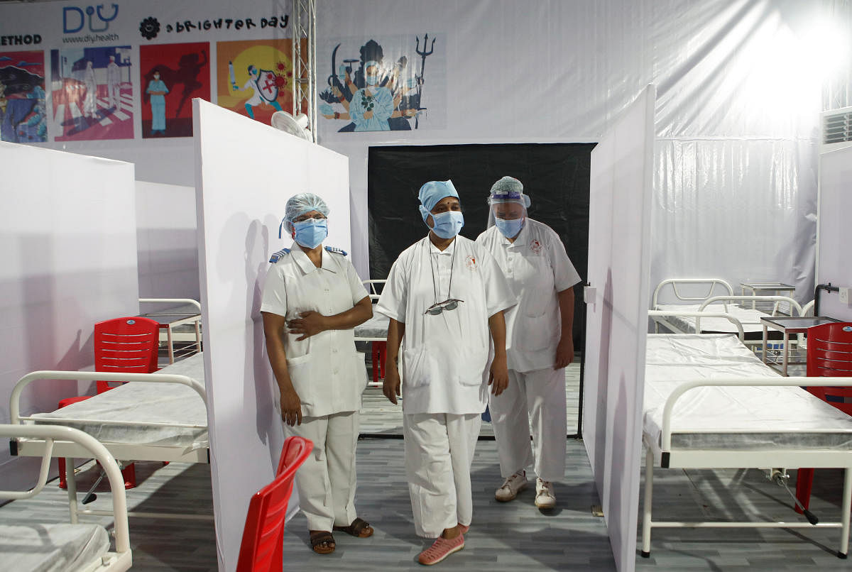 Nurses wearing protective masks stand inside a temporary facility created to facilitate cancer patients diagnosed with coronavirus disease in Mumbai, India, July 30, 2020. Credit: Reuters Photo