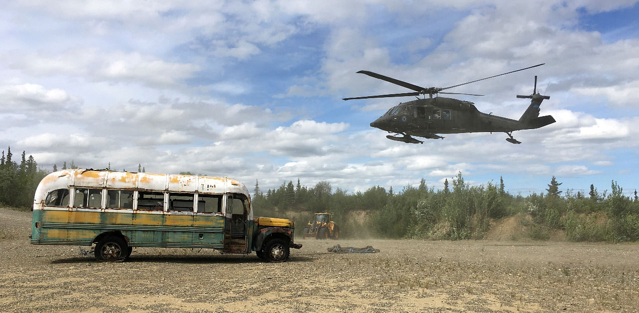 An Alaska Army National Guard UH 60 Blackhawk helicopter hovers near "Bus 142", made famous by the "Into the Wild" book and movie, after it was deposted by a CH-47 Chinook helicopter on the ground east of the Teklanika River alongside the Stampede Road, west of Healy, Alaska An Alaska Army National Guard UH 60 Blackhawk helicopter hovers near "Bus 142", made famous by the "Into the Wild" book and movie. Credit: Reuters