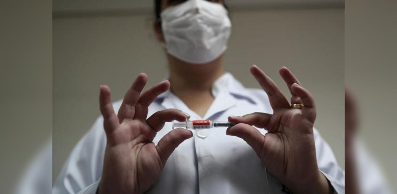 Representative image of a nurse with China's SinoVac trial vaccine before administering it to a volunteer. Credit: Reuters