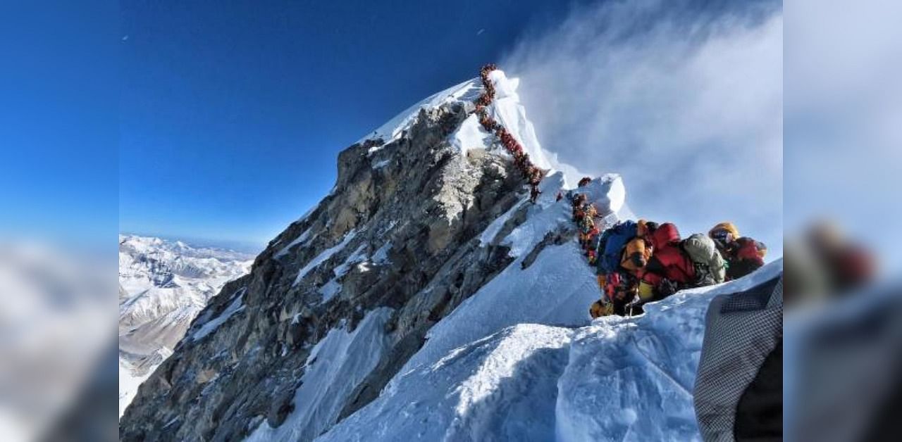 This handout photo released by @nimsdai Project Possible shows mountain climber traffic on Mount Everest. Credit: AFP