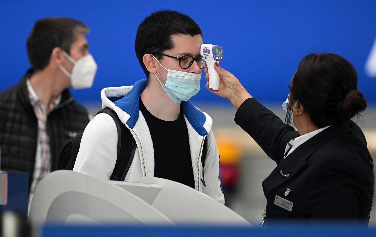  Passengers wearing face masks or covering due to the Covid-19 pandemic. Credit: AFP