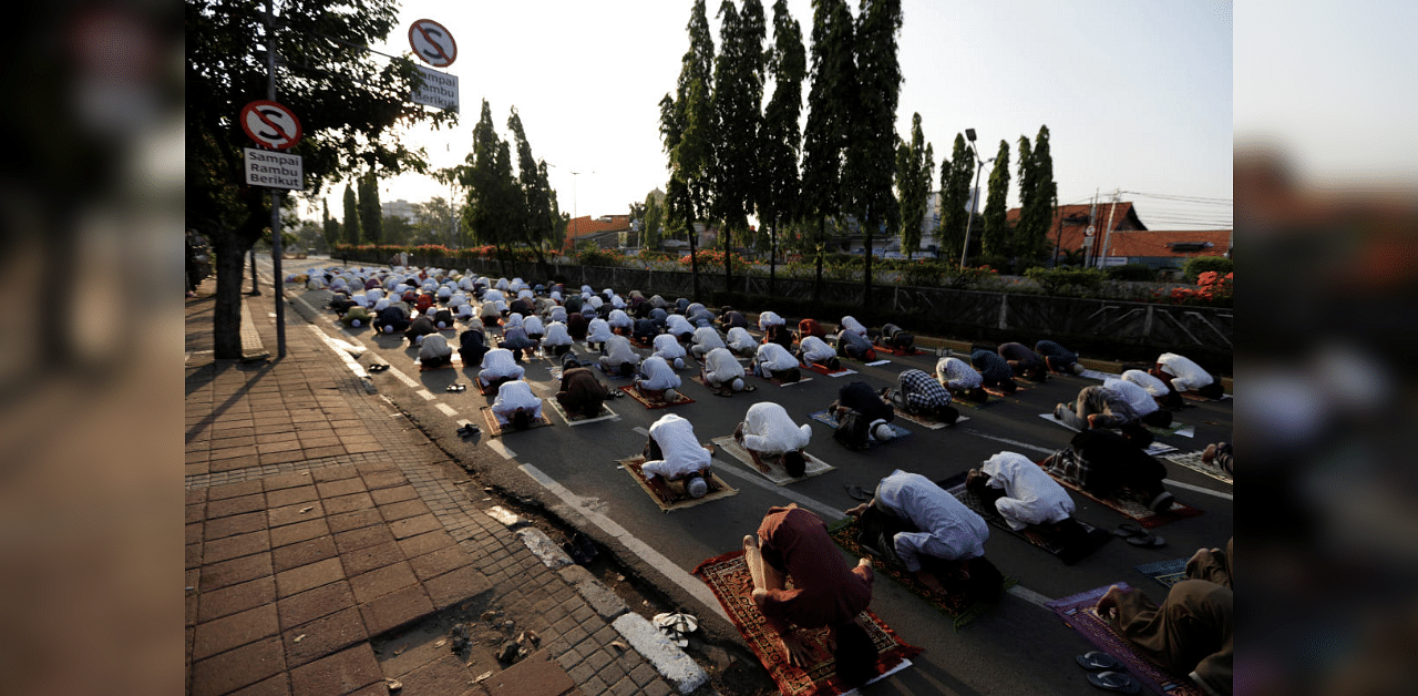 Indonesian Muslims offer Eid al-Adha prayers on the street in Jakarta, during the outbreak of the coronavirus disease. Credit: Reuters
