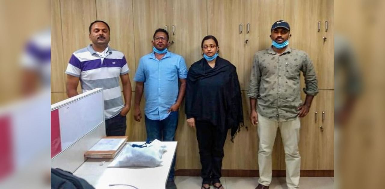Kerala gold smuggling case accused Swapna Suresh and Sandeep Nair (both in middle). Credit: PTI photo