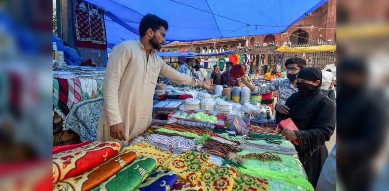 People shop near Jama Masjid on the eve of Eid al-Adha festival, in New Delhi, Friday, July 31, 2020. Credit: PTI Photo