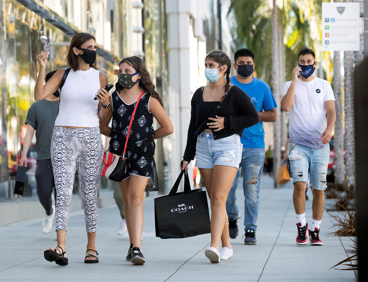 People wearing face masks walk during the outbreak of the coronavirus disease, in Beverly Hills, California, U.S. Credit: Reuters File Photo