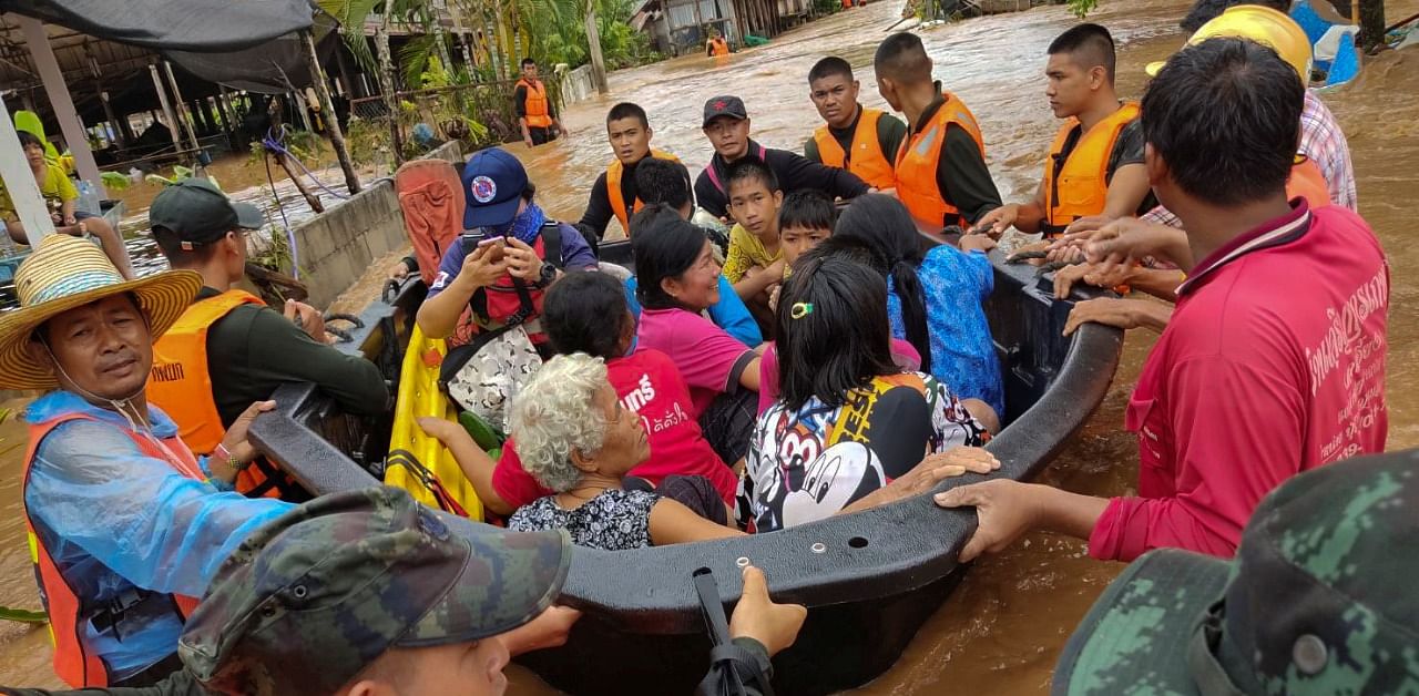 Soldiers evacuate villagers affected by heavy rain at Muang district in Loei province, Thailand. Credit: Reuters Photo