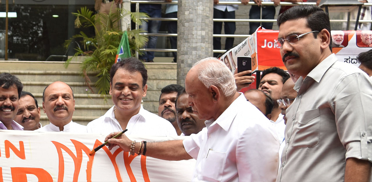 Chief Minister BS Yediyurappa inaugurates campaign for BJP along with BY Vijayendra. Credit: DH Photo/file