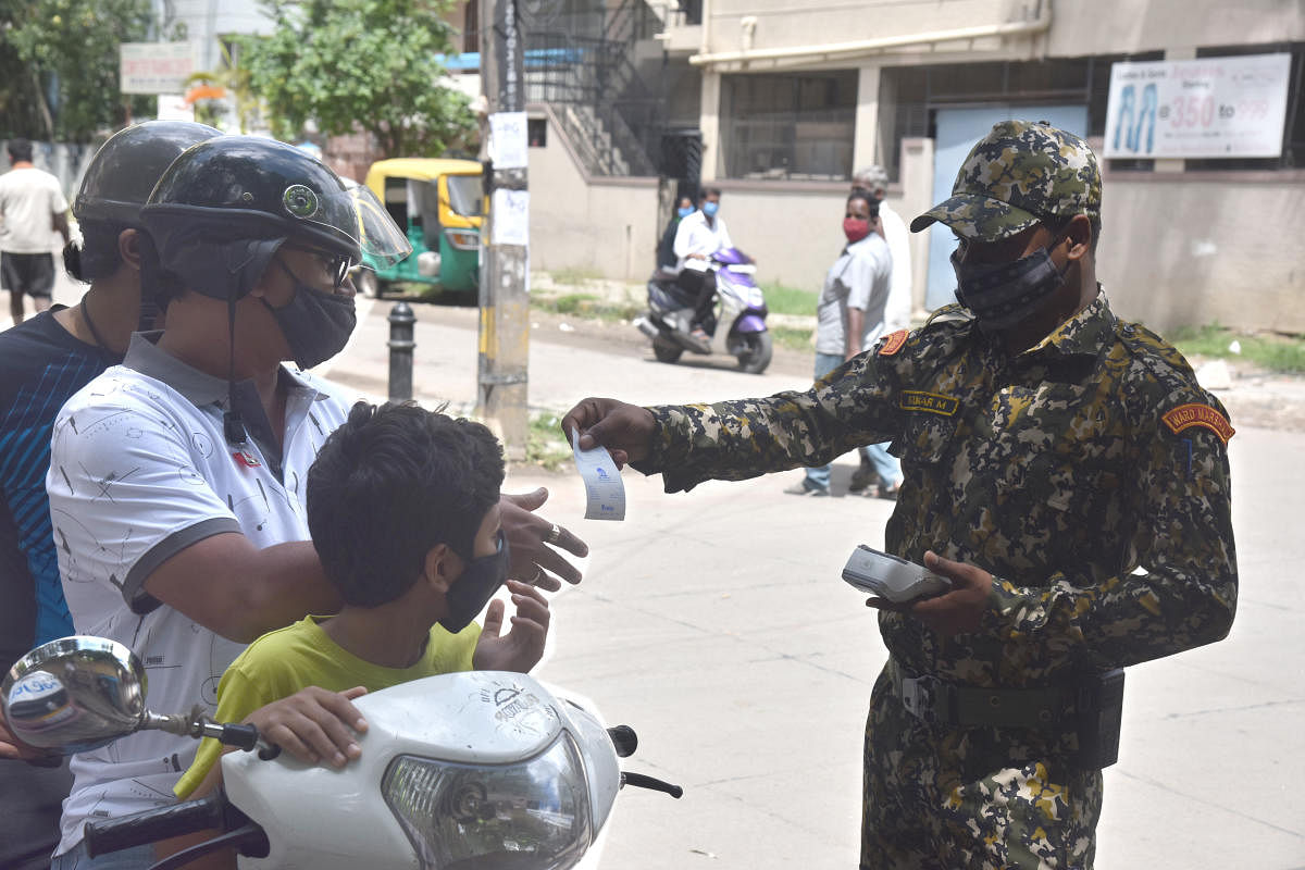 BBMP Marshall checking the people who are not taking covid precautions and put fine who not wearing the mask in Covid 19 lockdown unlock 3 in Bengaluru on Sunday, 02 August 2020. Photo by S K Dinesh