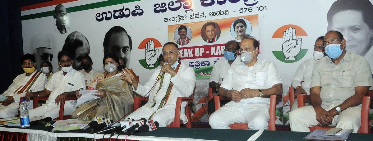 Congress leader Dinesh Gundu Rao speaks to reporters in Udupi.