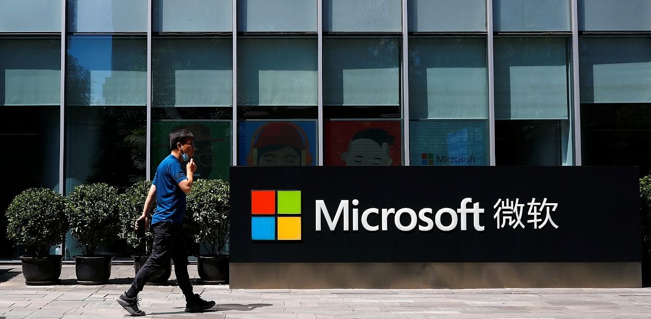 A person walks past a Microsoft logo at the Microsoft office in Beijing, China. Credit: Reuters Photo