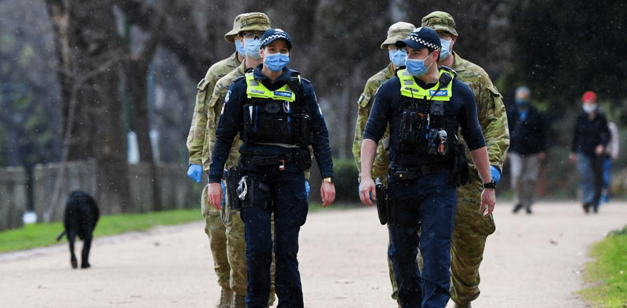 Police officers and soldiers patrol after the state announced new restrictions as the city battles fresh Covid-19 outbreaks. Credit: AFP