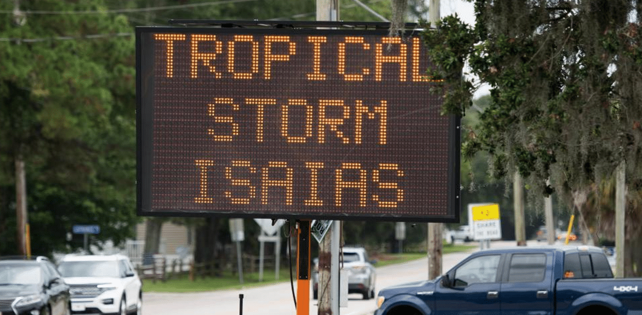 A sign warns of possible flooding due to Tropical Storm Isaias. Credit: AFP