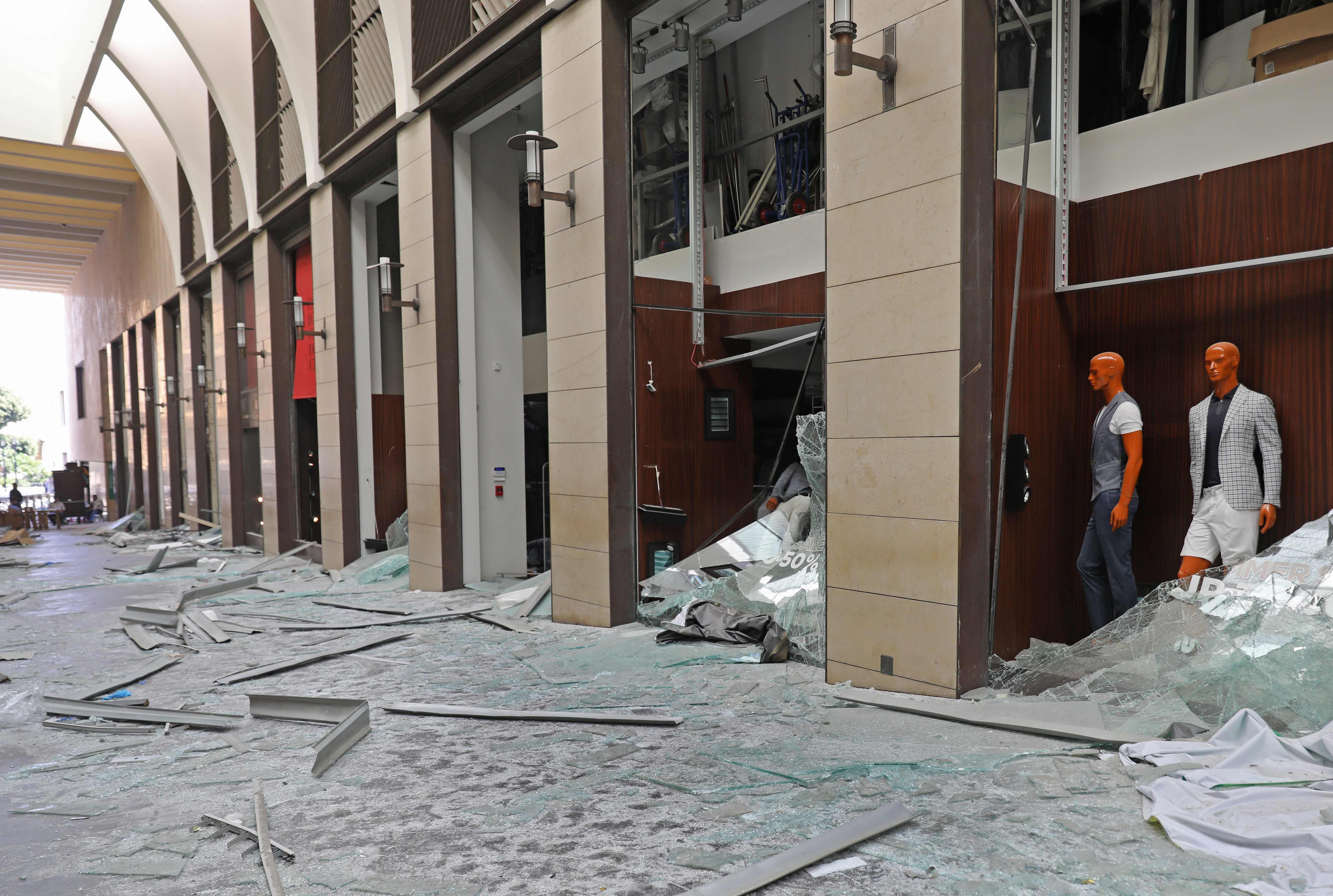 Shattered shop windows are pictured in the aftermath of yesterday's blast that tore through Lebanon's capital and resulted from the ignition of a huge depot of ammonium nitrate at Beirut's port, on August 5, 2020. - Rescuers searched for survivors in Beirut after a cataclysmic explosion at the port sowed devastation across entire neighbourhoods, killing more than 100 people, wounding thousands and plunging Lebanon deeper into crisis. Credit: AFP