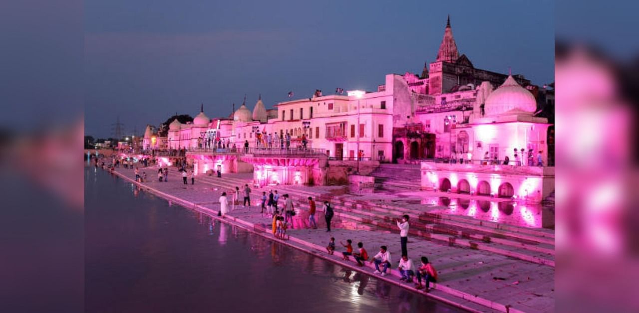 Temples and other buildings on the bank of Sarayu river are seen illuminated ahead of the foundation-laying ceremony for a Hindu temple in Ayodhya. Credit: Reuters