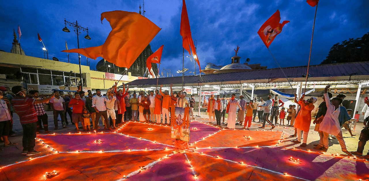 Gayawal Pandas community members light earthen lamps to celebrate the groundbreaking ceremony of the Ram Temple, in Ayodhya. Credit: PTI Photo